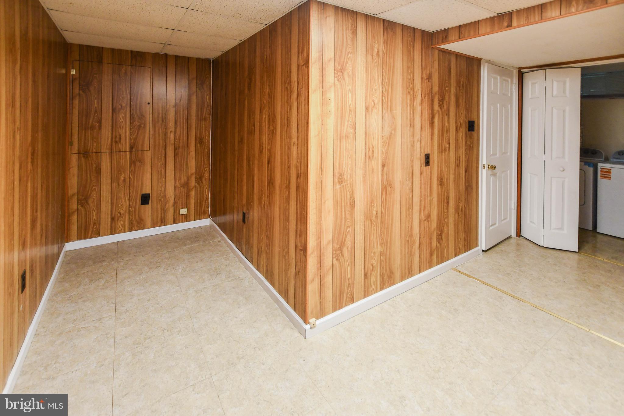 12411 Sturdee Drive Upper Marlboro, MD 20772 - Photo 35 of 39 a view of a livingroom with wooden walls