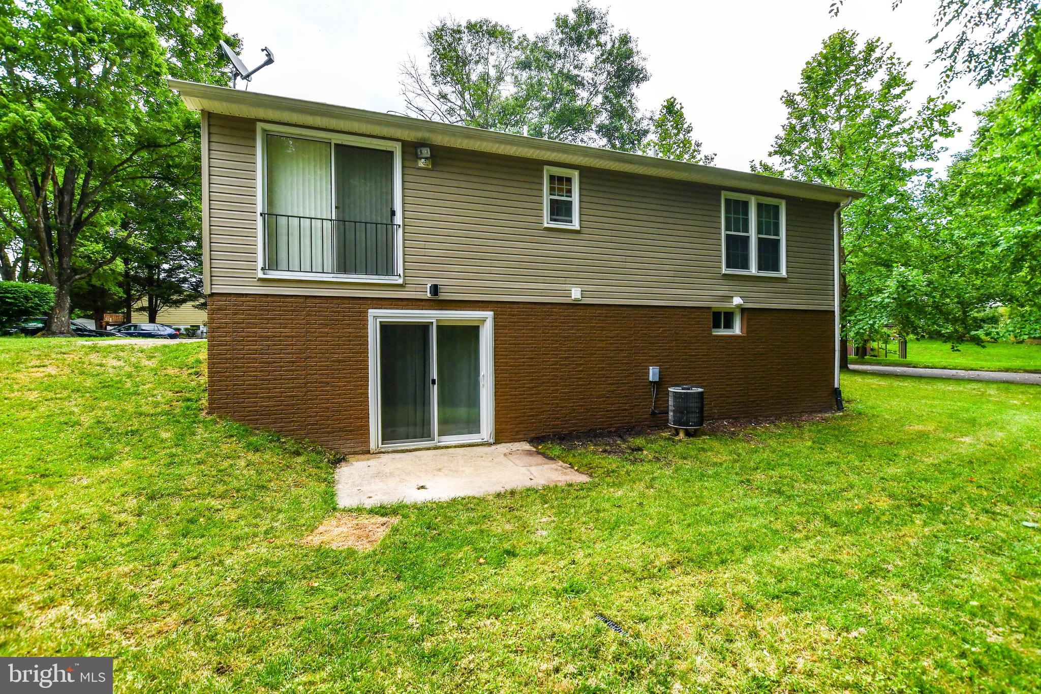12411 Sturdee Drive Upper Marlboro, MD 20772 - Photo 36 of 39 a backyard of a house with lots of green space