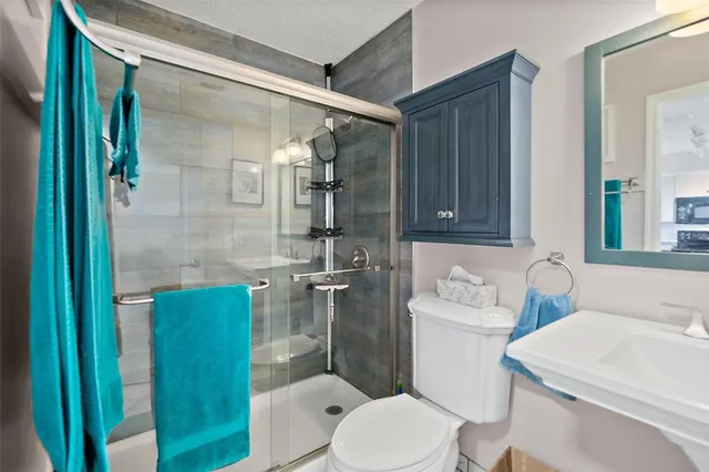 a bathroom with a sink vanity and a mirror