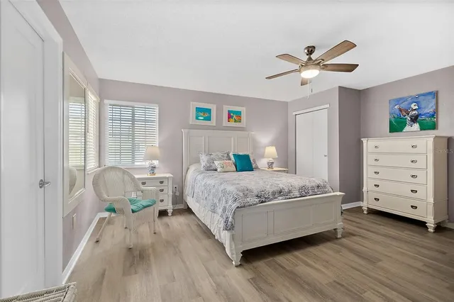 a bedroom with a bed and a dresser in it