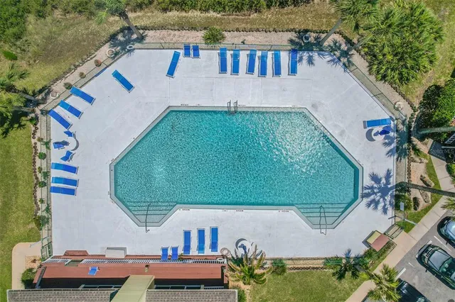 an aerial view of a house with a garden
