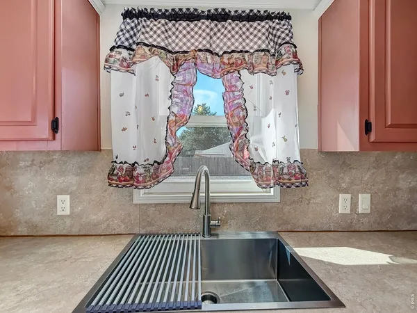 a kitchen with a sink and a stove