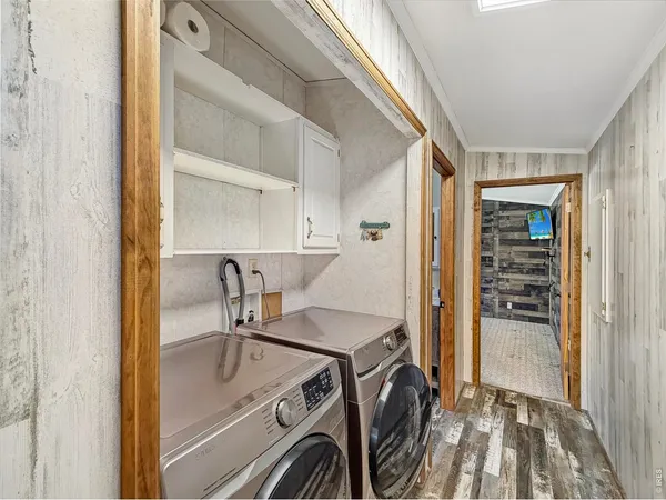 a view of an empty room with a ceiling fan