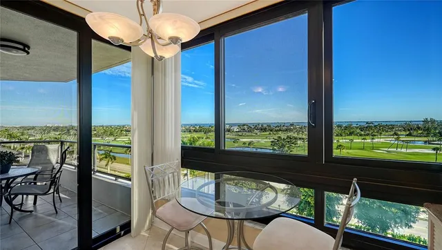 a view of a room with furniture and window
