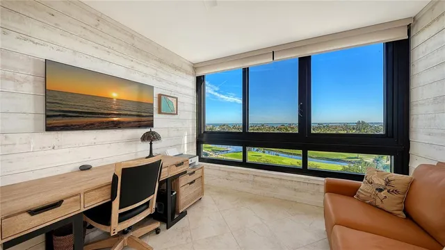 a reading room with furniture and a flat screen tv
