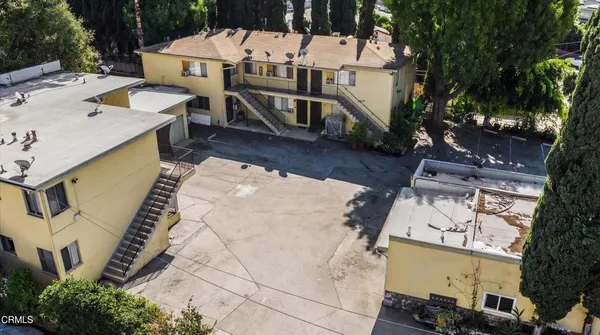 an aerial view of a house with outdoor space