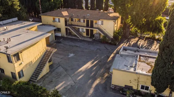 a view of a house with wooden deck