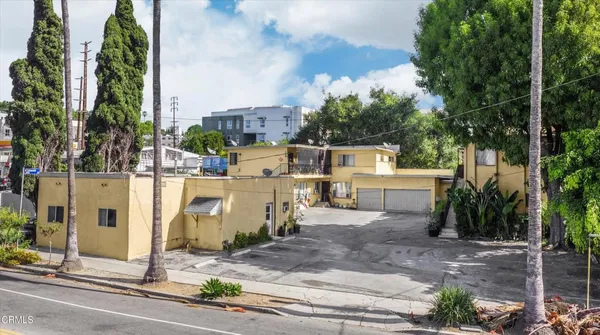 a view of a patio with table and chairs and a fire pit