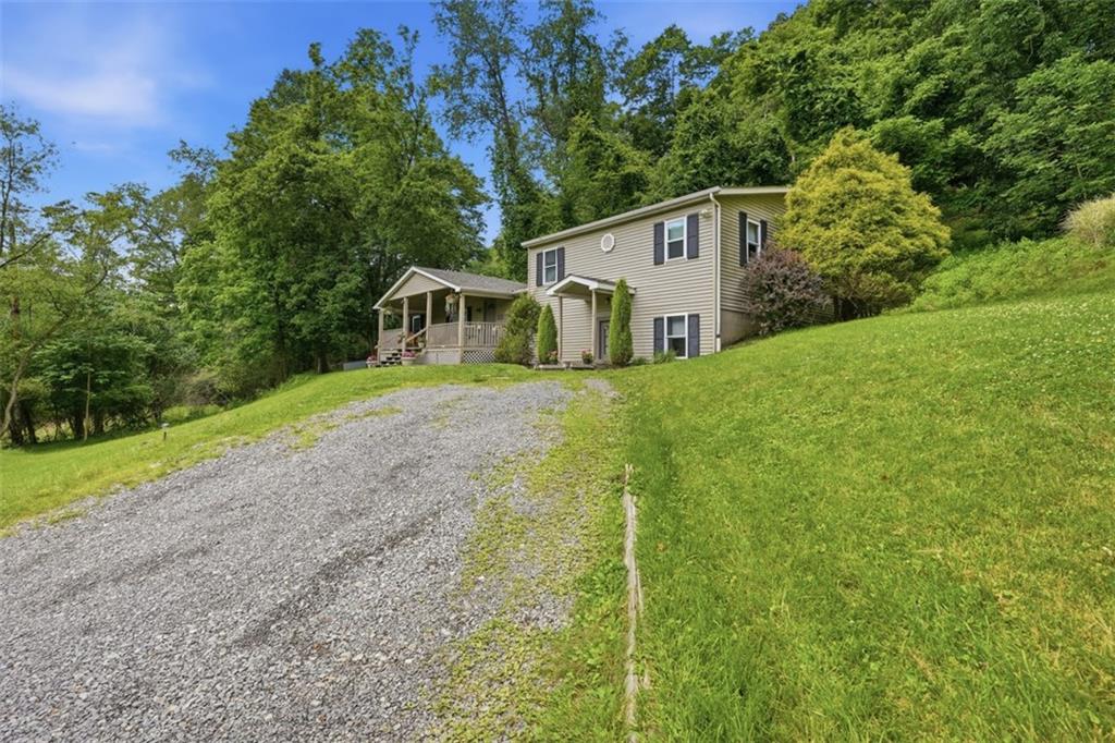 8517 Wittmer Road Pittsburgh, PA 15237 - Photo 42 of 46 a front view of a house with a yard and garage