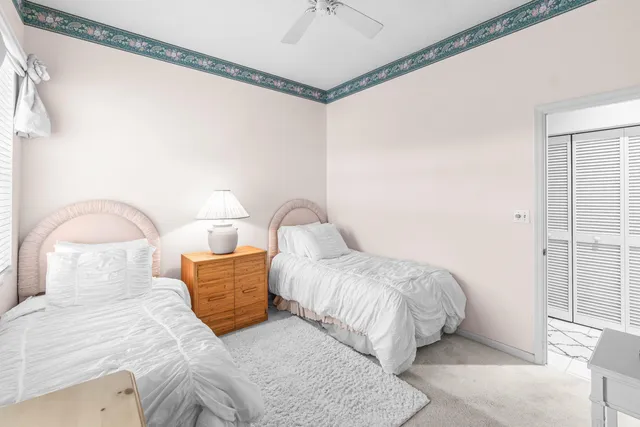 a living room with a floor to ceiling window and pool table