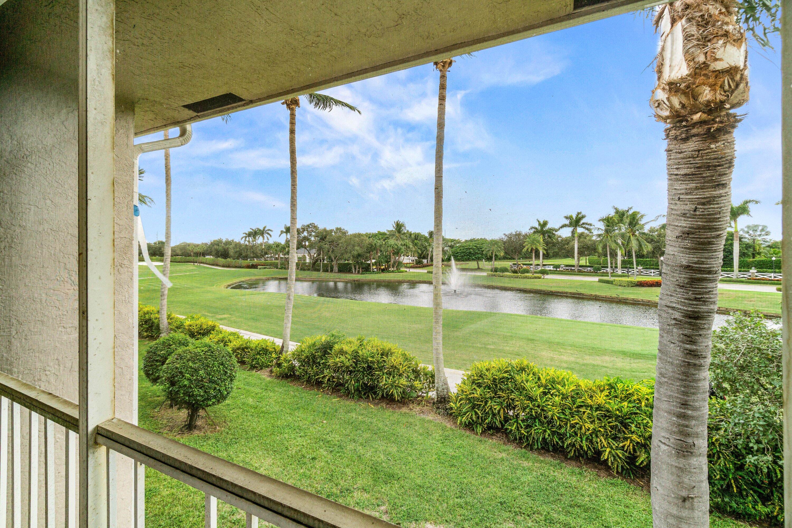 5184 Lake Catalina Drive, Unit D Boca Raton, FL 33496 - Photo 27 of 54 a view of a lake with a big yard
