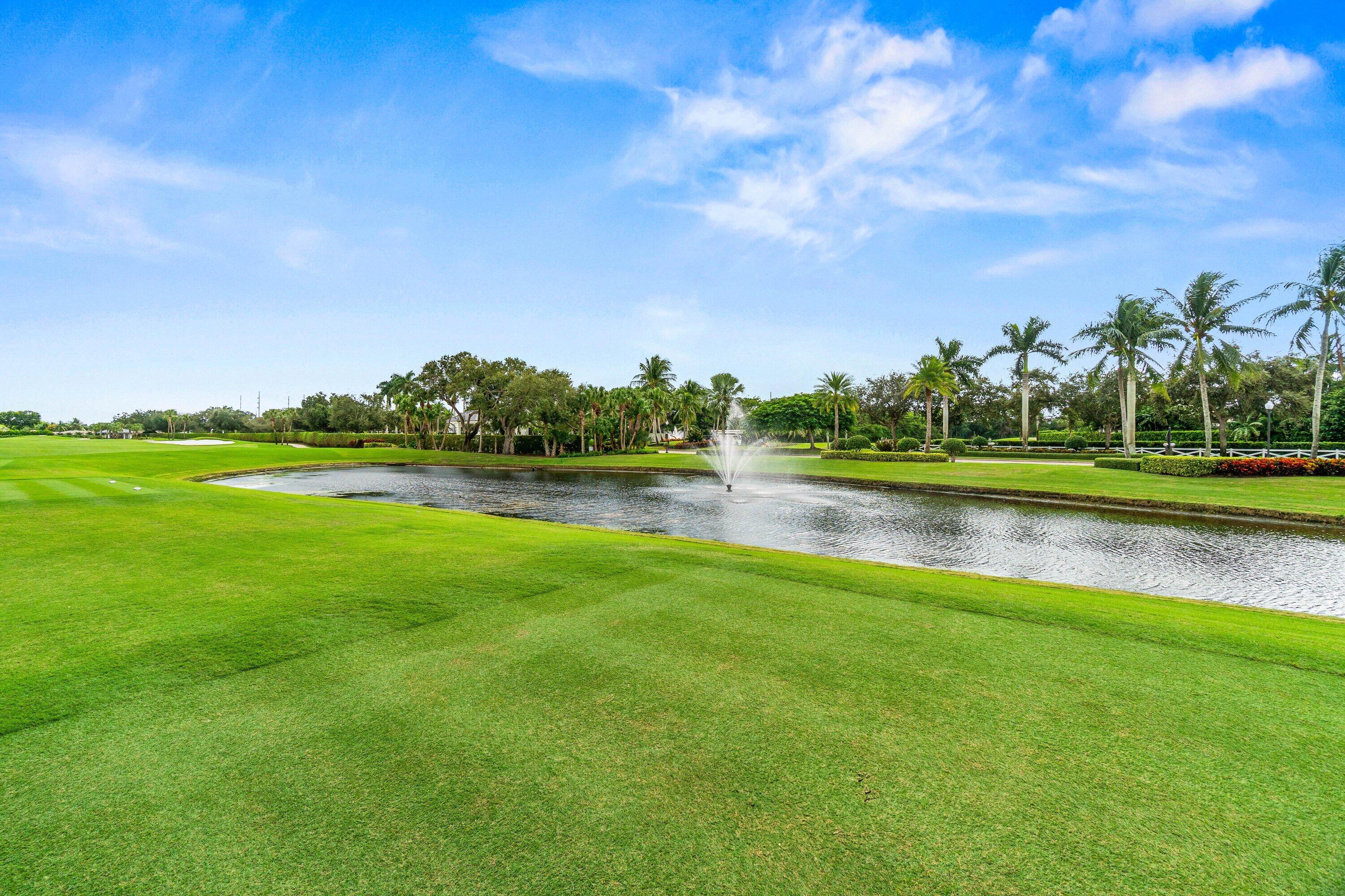 5184 Lake Catalina Drive, Unit D Boca Raton, FL 33496 - Photo 29 of 54 a view of a lake with houses in the background