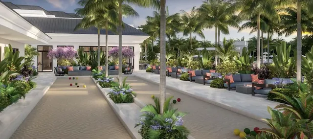 a view of a patio with couches table and chairs and potted plants