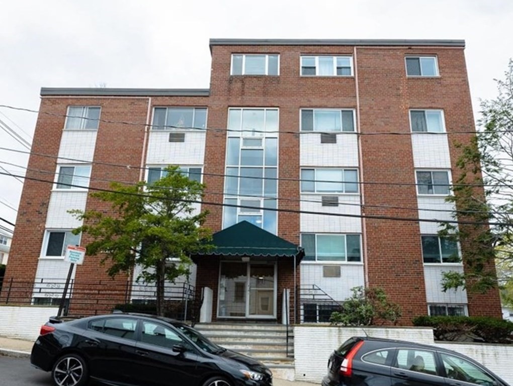 2 Larose Place, Unit 8 Boston, MA 02135 - Photo 1 of 19 a car parked in front of a building