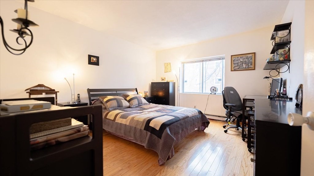 2 Larose Place, Unit 8 Boston, MA 02135 - Photo 12 of 19 a bedroom with a bed and a desk