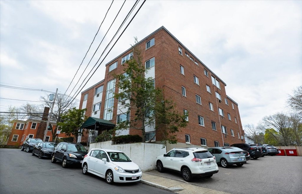 2 Larose Place, Unit 8 Boston, MA 02135 - Photo 13 of 19 a car parked in front of a building