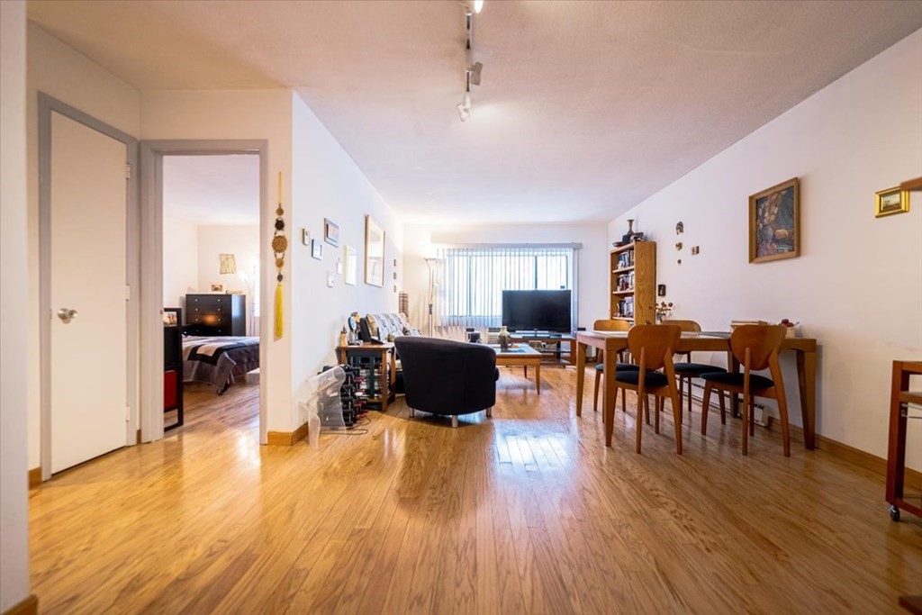 2 Larose Place, Unit 8 Boston, MA 02135 - Photo 2 of 19 a living room with furniture and wooden floor