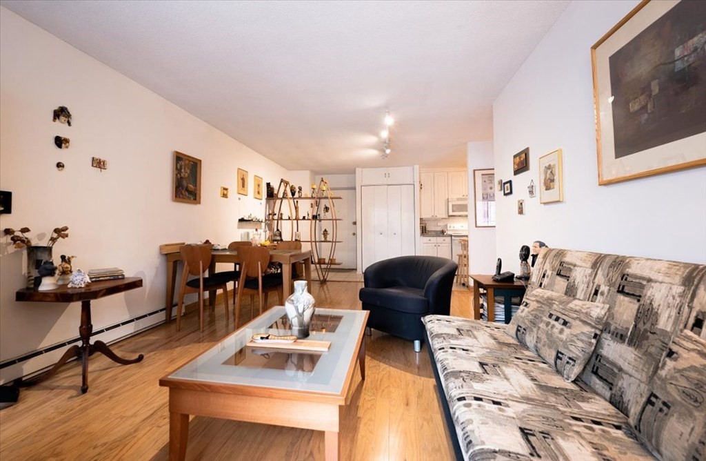 2 Larose Place, Unit 8 Boston, MA 02135 - Photo 6 of 19 a living room with furniture and wooden floor