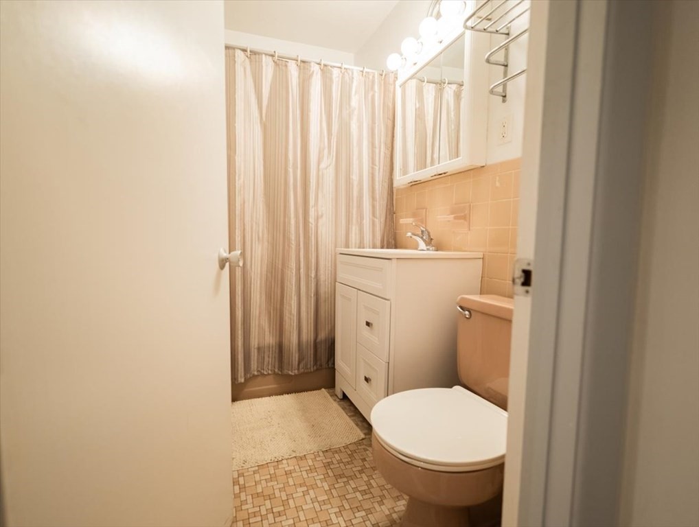 2 Larose Place, Unit 8 Boston, MA 02135 - Photo 8 of 19 a bathroom with a toilet and a sink