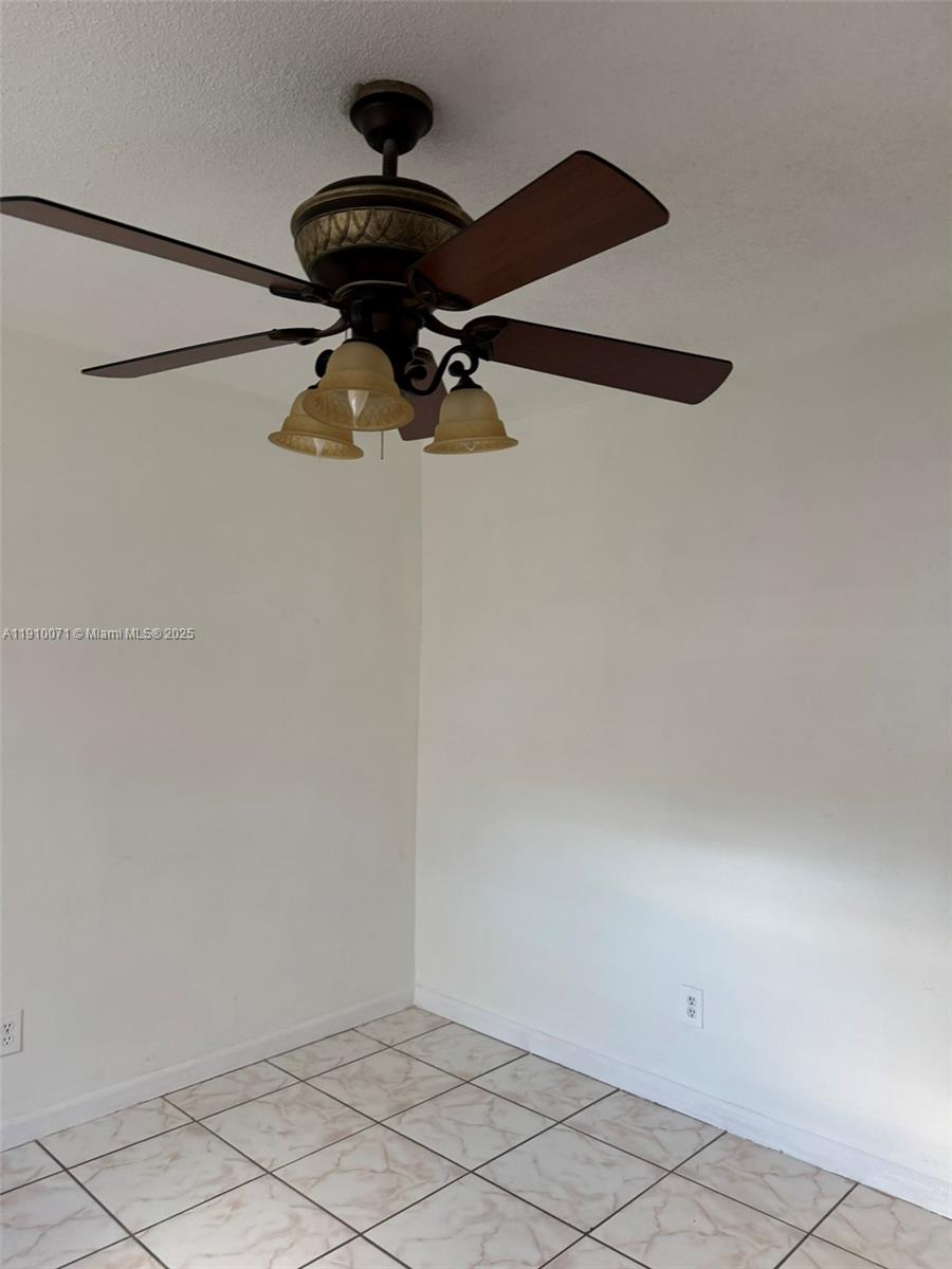 50 West 23rd Street, Unit 15 Hialeah, FL 33010 - Photo 11 of 19 a view of a chandelier fan