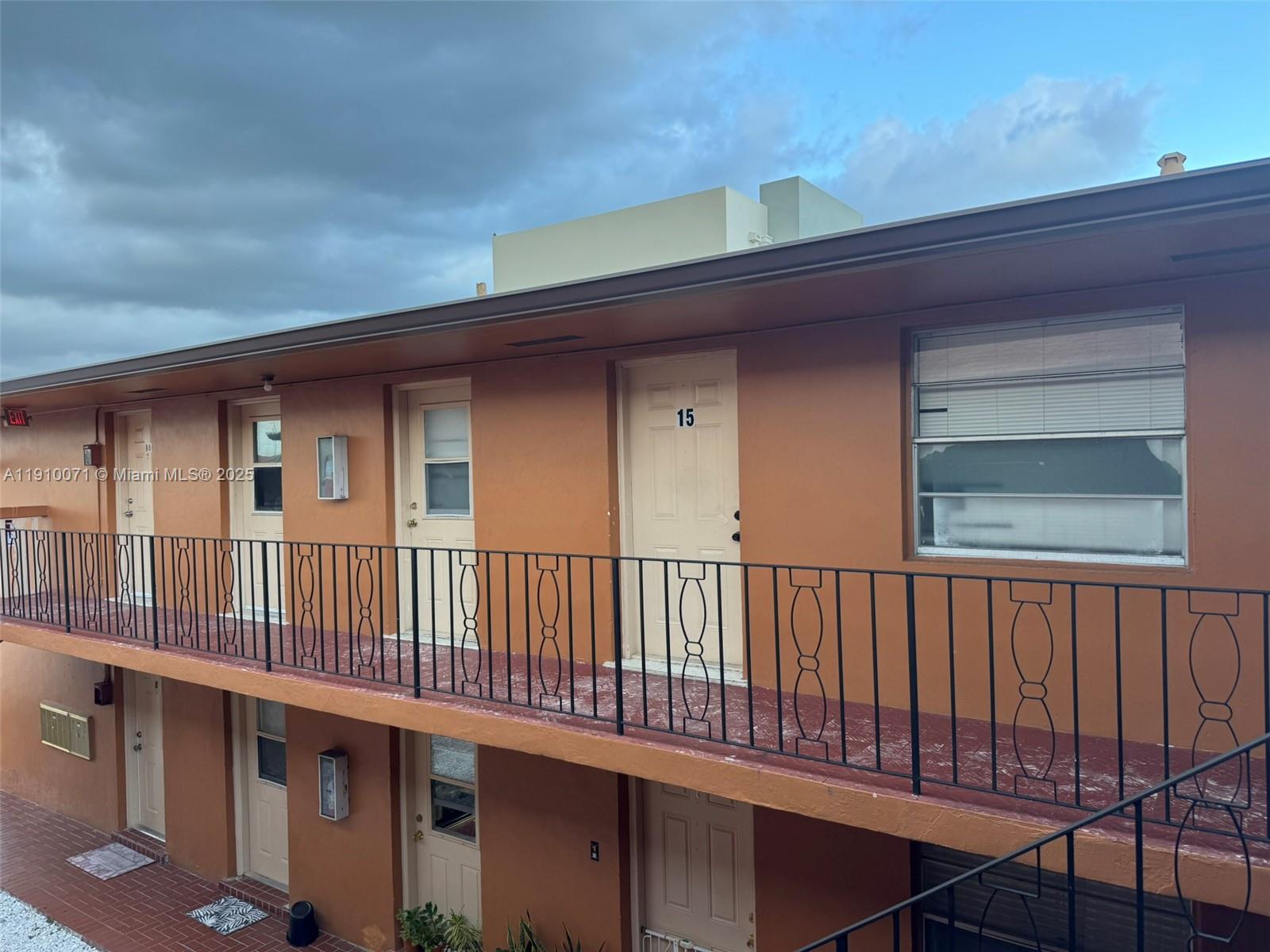 50 West 23rd Street, Unit 15 Hialeah, FL 33010 - Photo 16 of 19 a view of a house with wooden deck