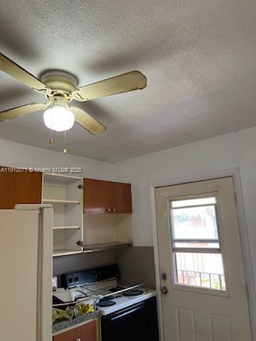 50 West 23rd Street, Unit 15 Hialeah, FL 33010 - Photo 4 of 19 a room with cabinets and window