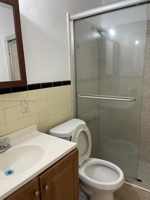 50 West 23rd Street, Unit 15 Hialeah, FL 33010 - Photo 9 of 19 a bathroom with a sink mirror toilet and shower