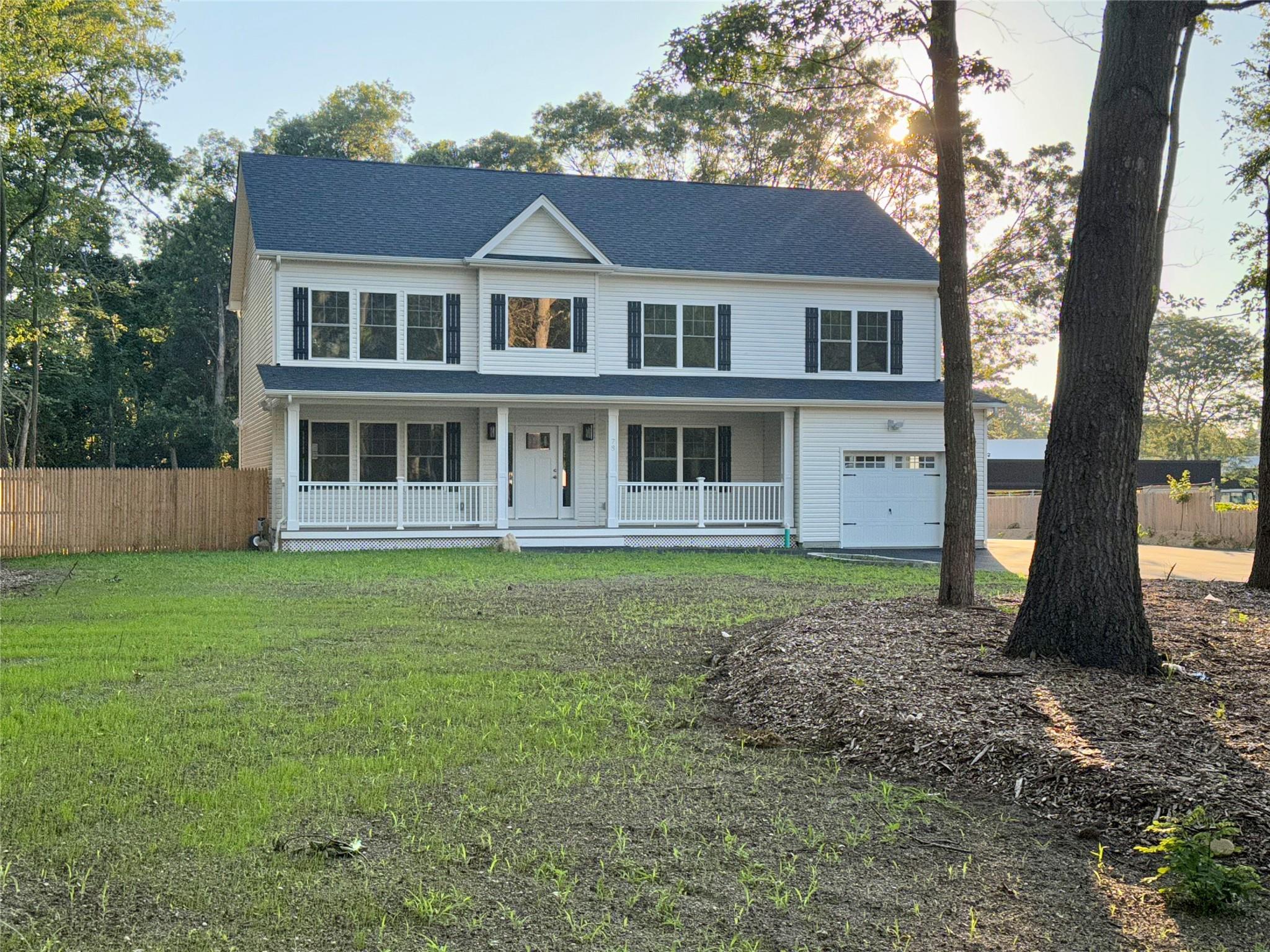 78 Horseblock Road Centereach, NY 11720 - Photo 1 of 1 View of front of property with covered porch and an attached garage