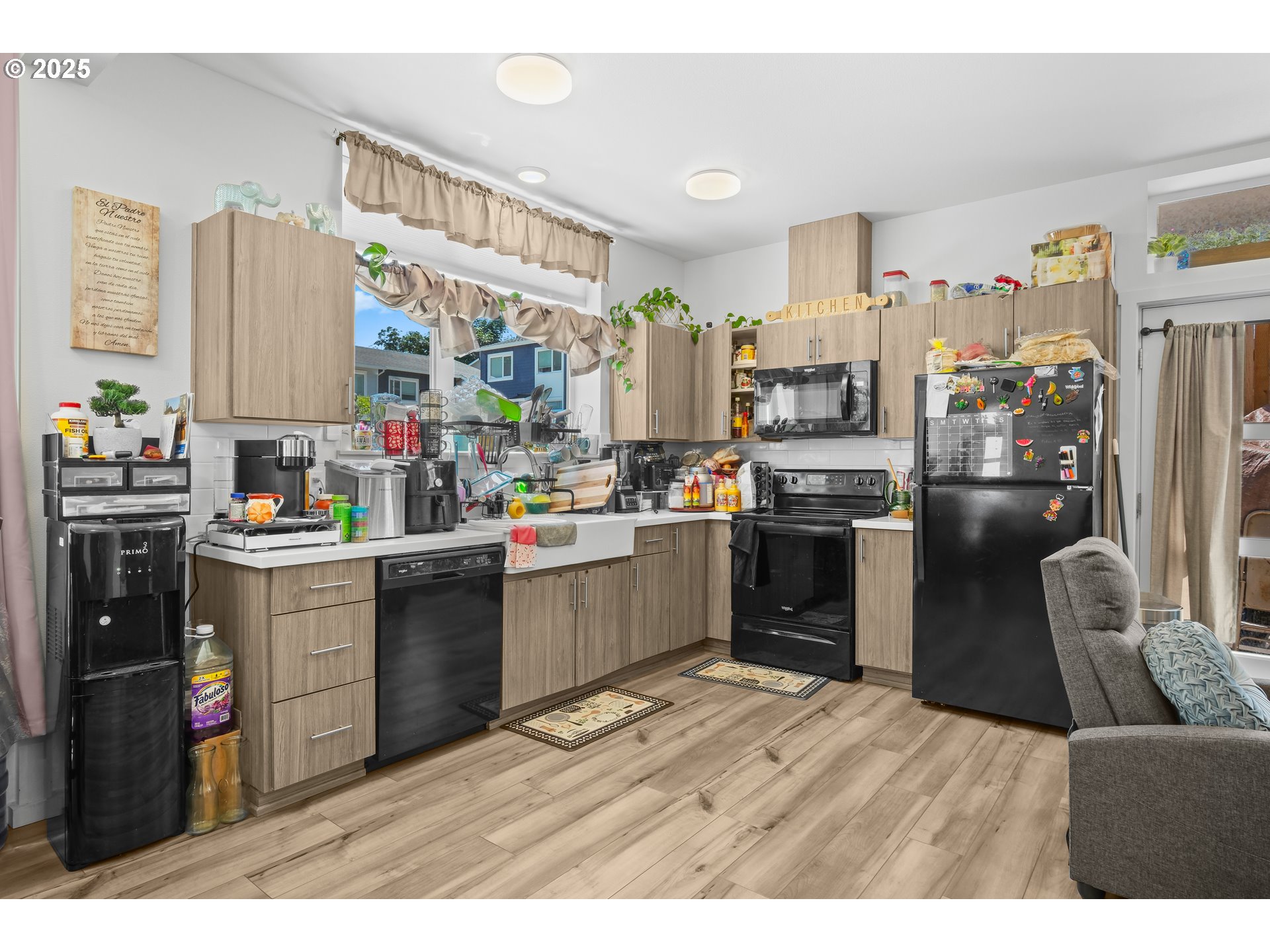 13425 Southeast Foster Road, Unit 40 Portland, OR 97236 - Photo 14 of 14 a open kitchen with stainless steel appliances granite countertop a refrigerator a sink dishwasher stove and oven with wooden cabinets