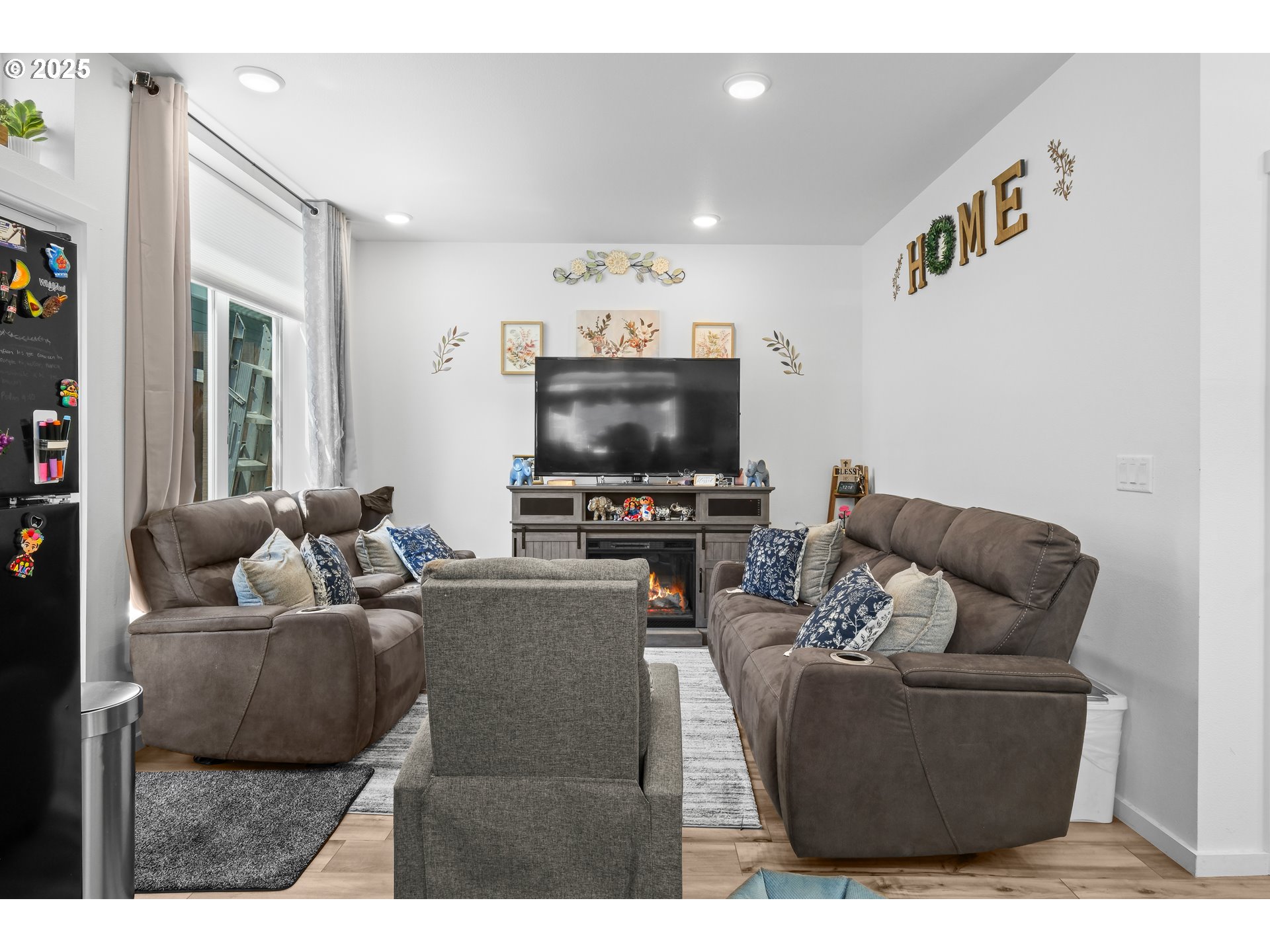 13425 Southeast Foster Road, Unit 40 Portland, OR 97236 - Photo 3 of 14 a living room with furniture and a flat screen tv