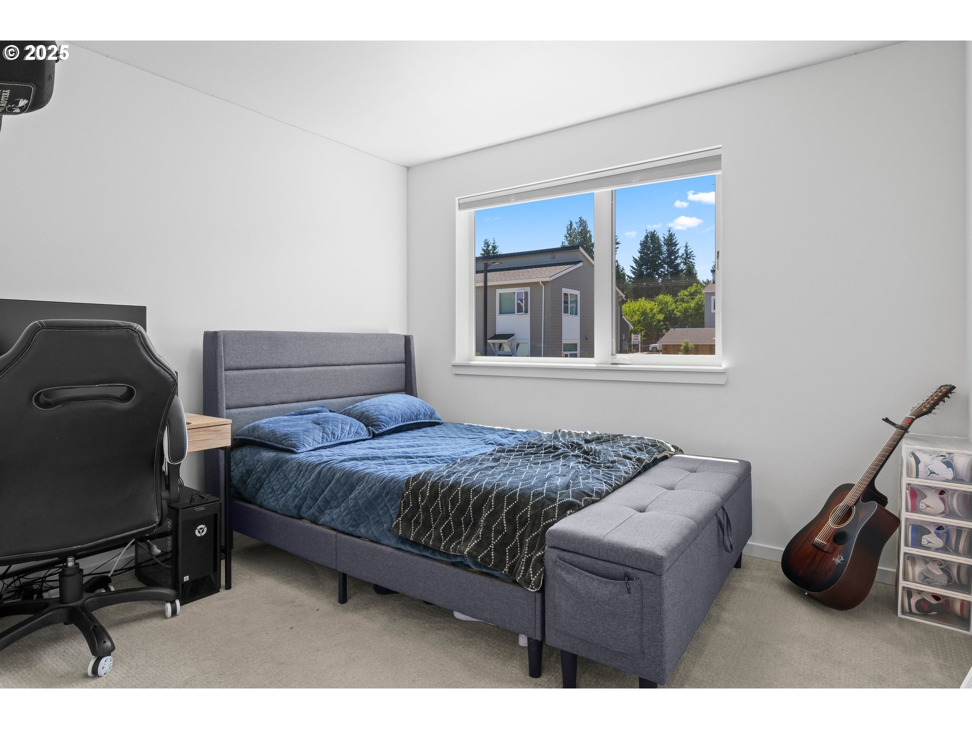 13425 Southeast Foster Road, Unit 40 Portland, OR 97236 - Photo 5 of 14 a bedroom with a bed and a window
