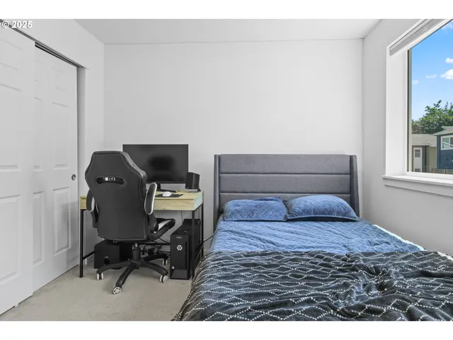 a bedroom with toys and a wooden floor