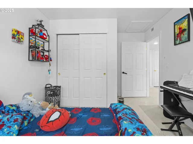 a bedroom with a bed and a dresser