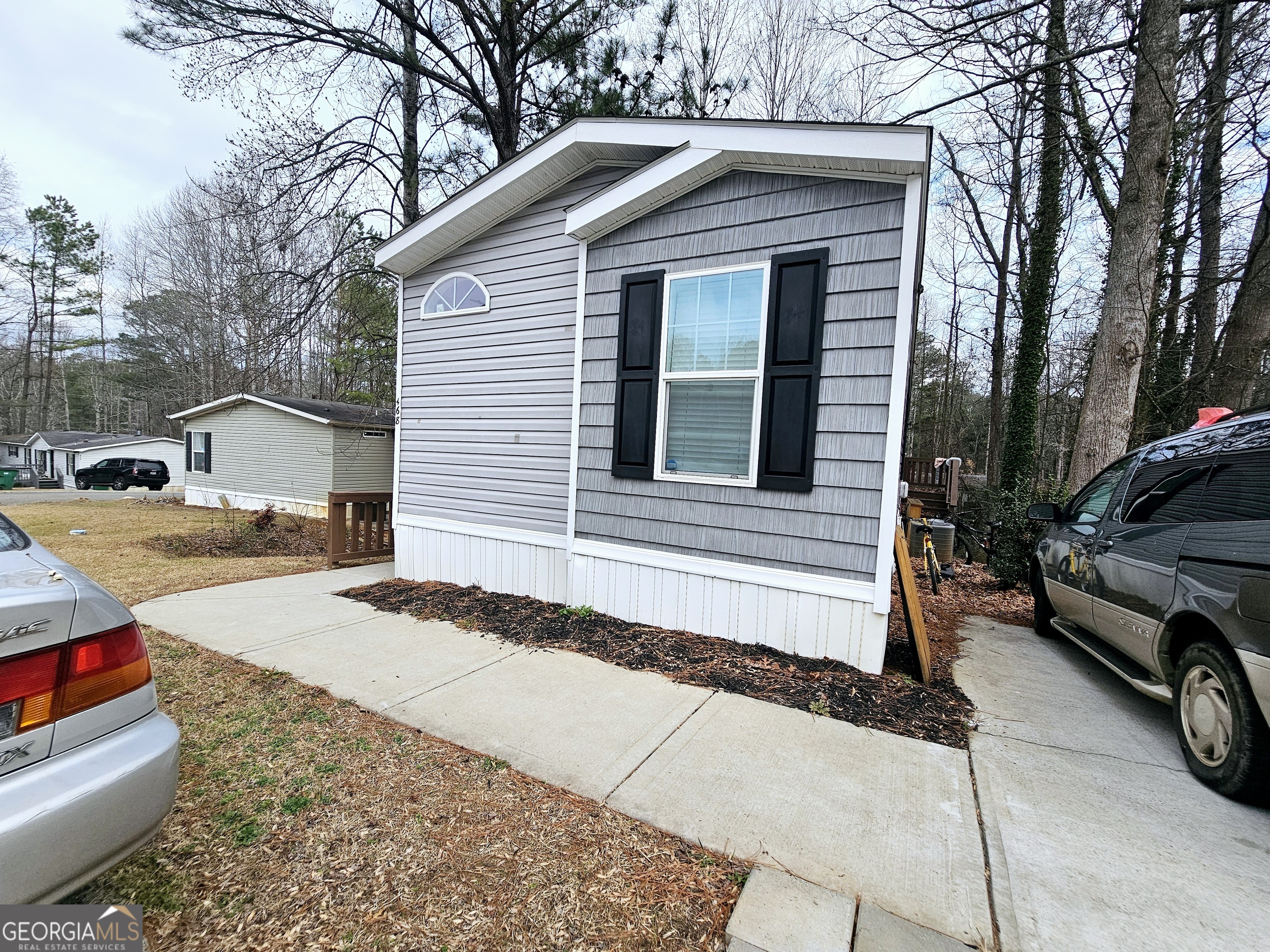 a view of a car park in front of house