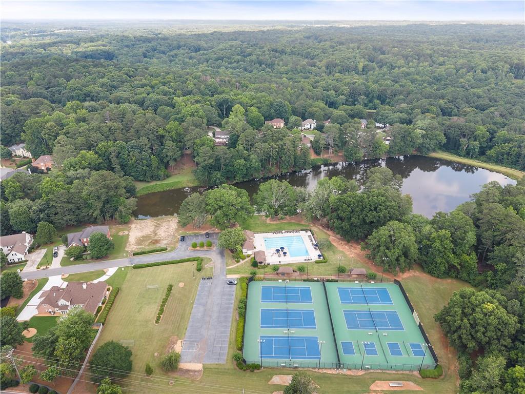 8965 Laurel Way Alpharetta, GA 30022 - Photo 70 of 79 an aerial view of a house with a yard
