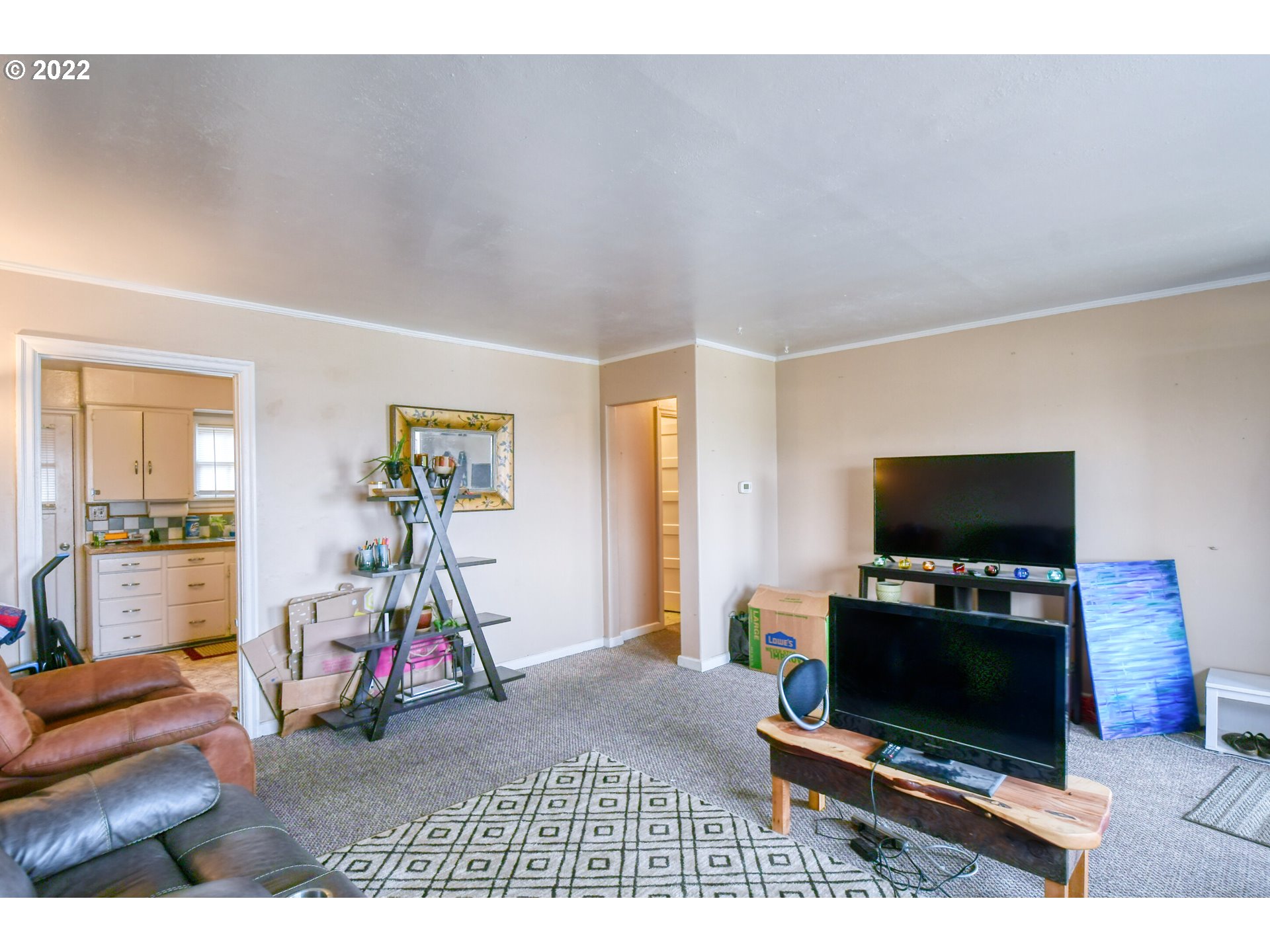 1302 Southwest Goodwin Lane Pendleton, OR 97801 - Photo 11 of 21 a living room with furniture and a flat screen tv