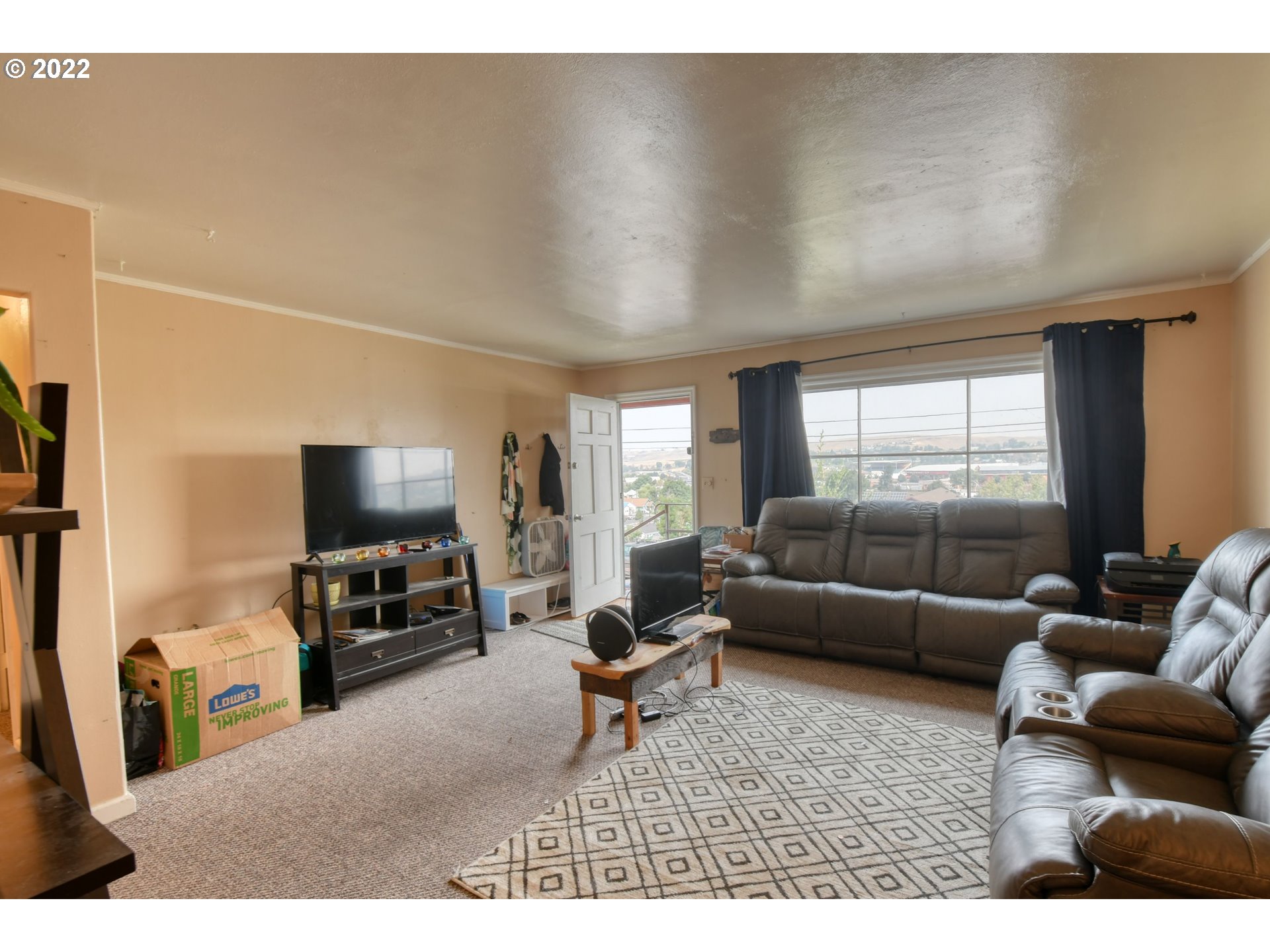 1302 Southwest Goodwin Lane Pendleton, OR 97801 - Photo 12 of 21 a living room with furniture and a flat screen tv