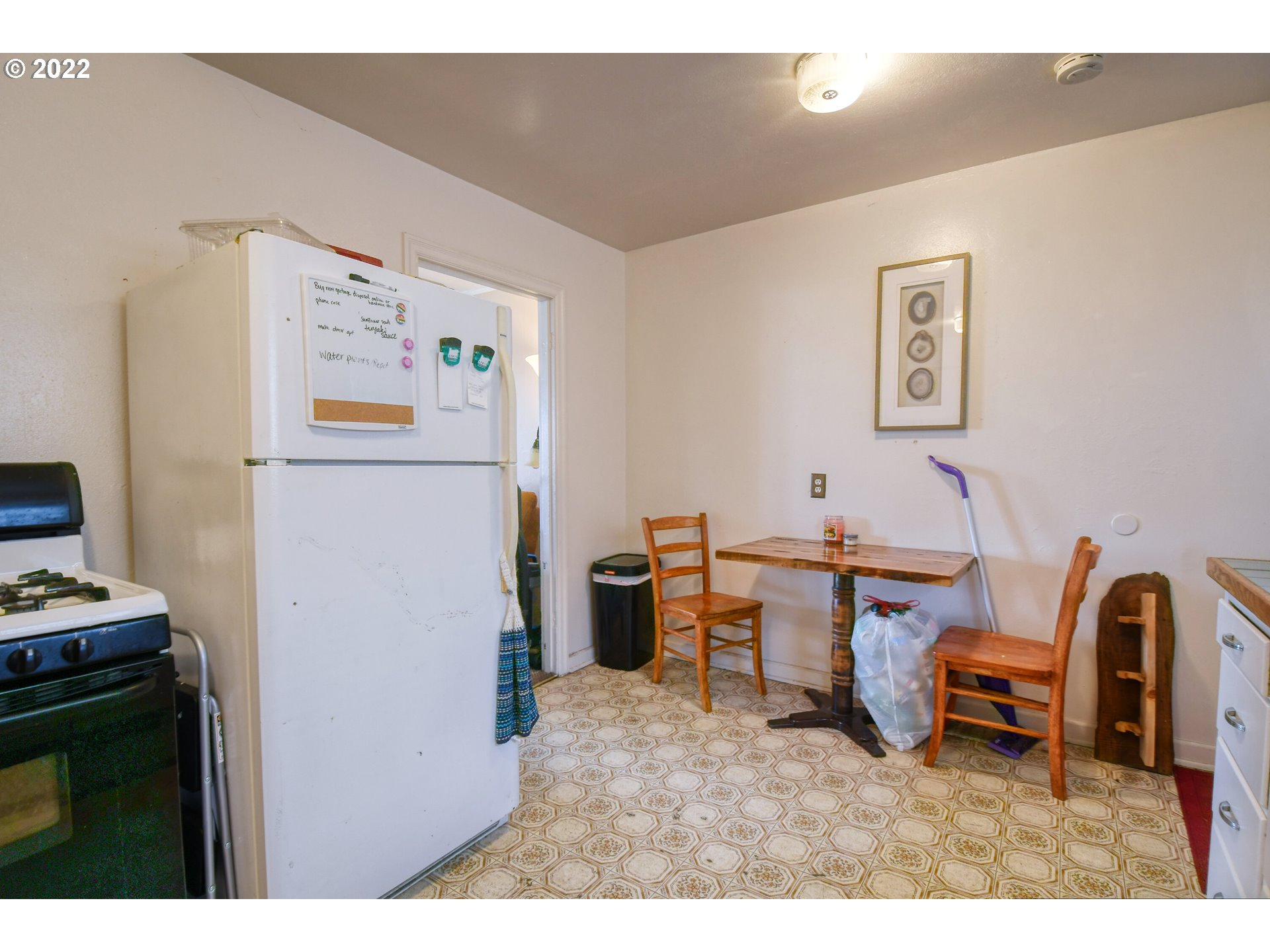 1302 Southwest Goodwin Lane Pendleton, OR 97801 - Photo 16 of 21 a living room with furniture and a refrigerator