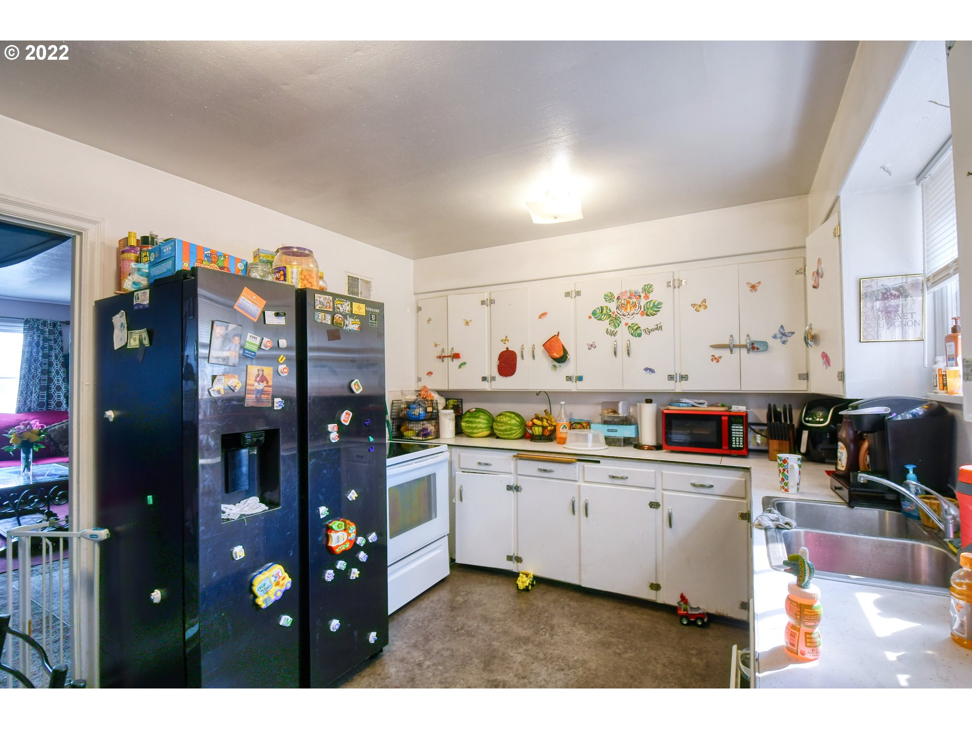 1302 Southwest Goodwin Lane Pendleton, OR 97801 - Photo 2 of 21 a kitchen filled with stainless steel appliances kitchen island granite countertop a refrigerator and cabinets