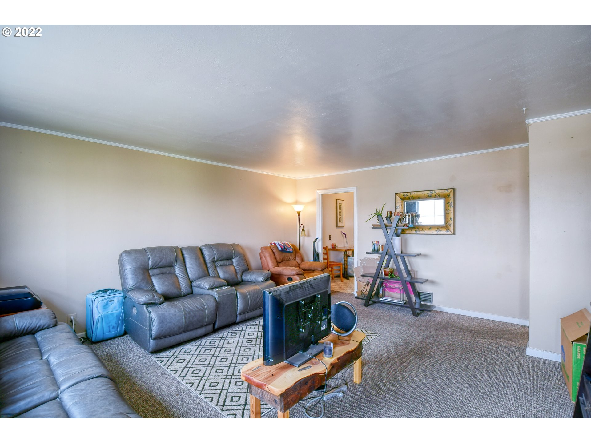 1302 Southwest Goodwin Lane Pendleton, OR 97801 - Photo 10 of 21 a living room with furniture and a wooden floor