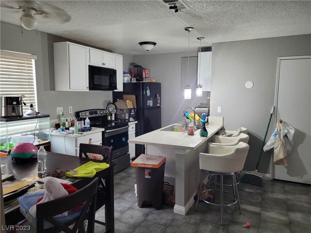 2194 East Desert Inn Road Las Vegas, NV 89169 - Photo 6 of 15 Stainless oven, Microwave, Quartz countertops