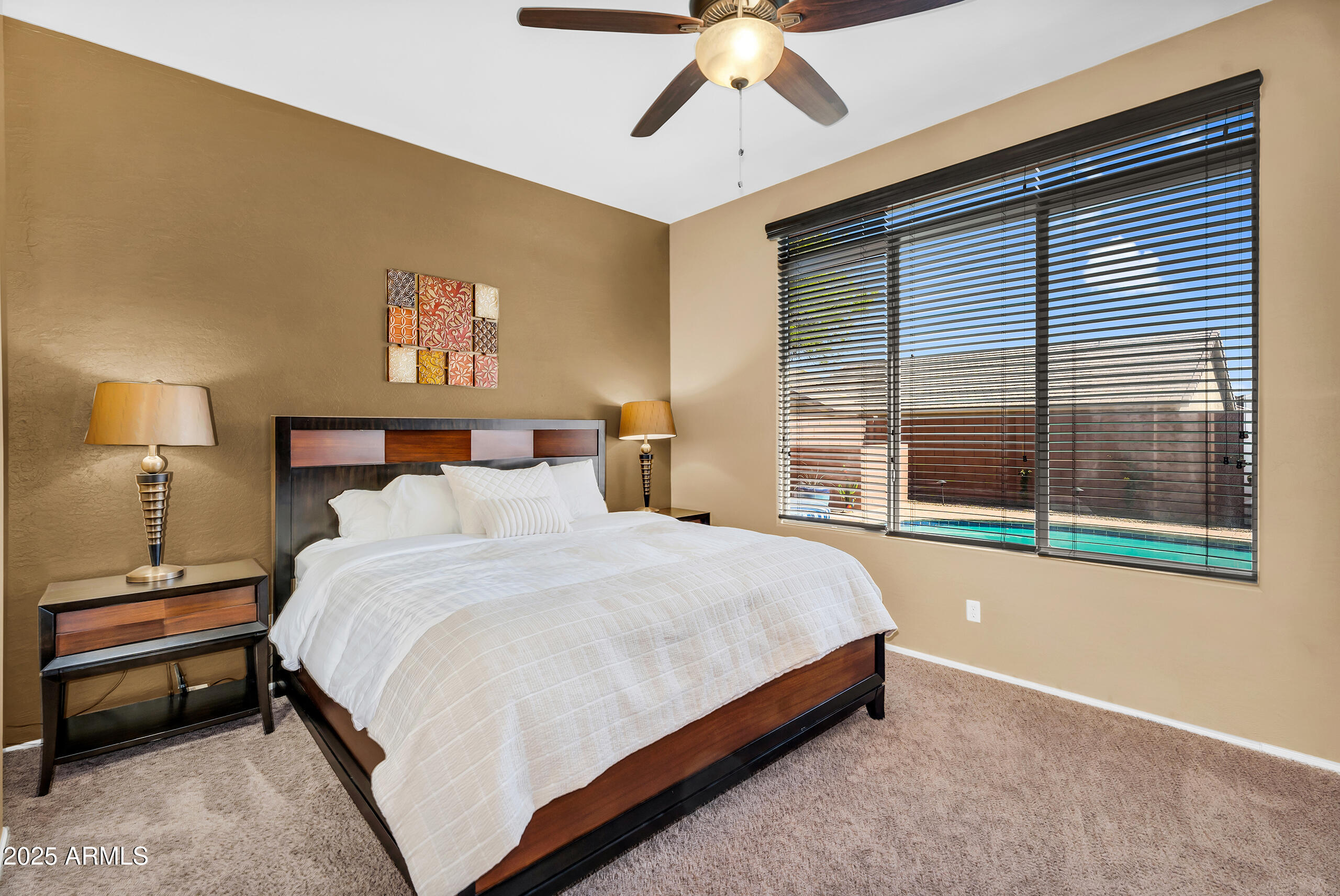 4821 East Kirkland Road Phoenix, AZ 85054 - Photo 14 of 22 a bedroom with a bed and a large window with the outer view