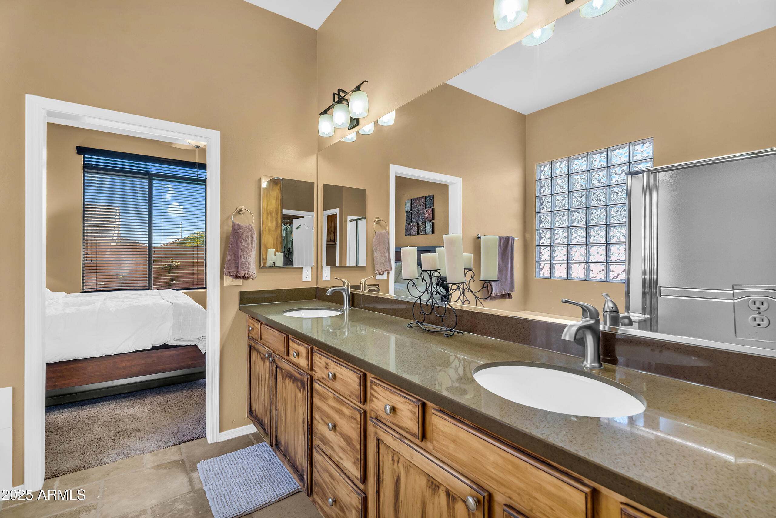 4821 East Kirkland Road Phoenix, AZ 85054 - Photo 15 of 22 a bathroom with a granite countertop sink and a large mirror