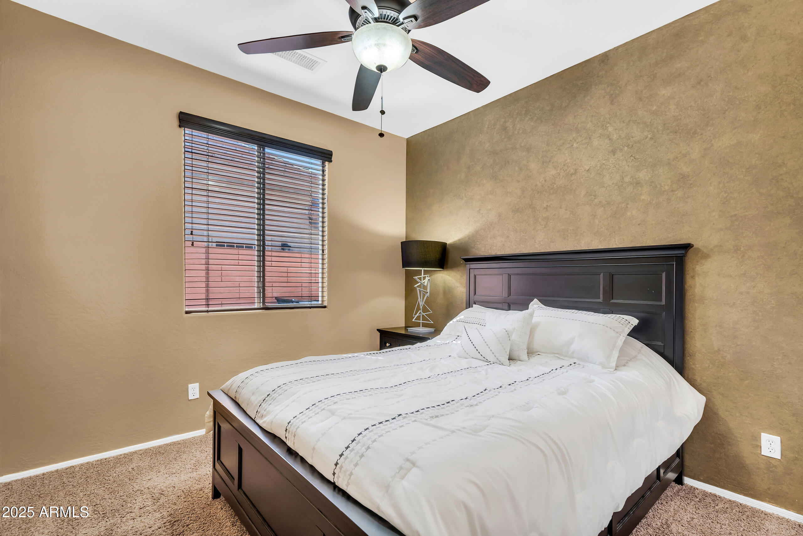 4821 East Kirkland Road Phoenix, AZ 85054 - Photo 18 of 22 a bedroom with a bed and window
