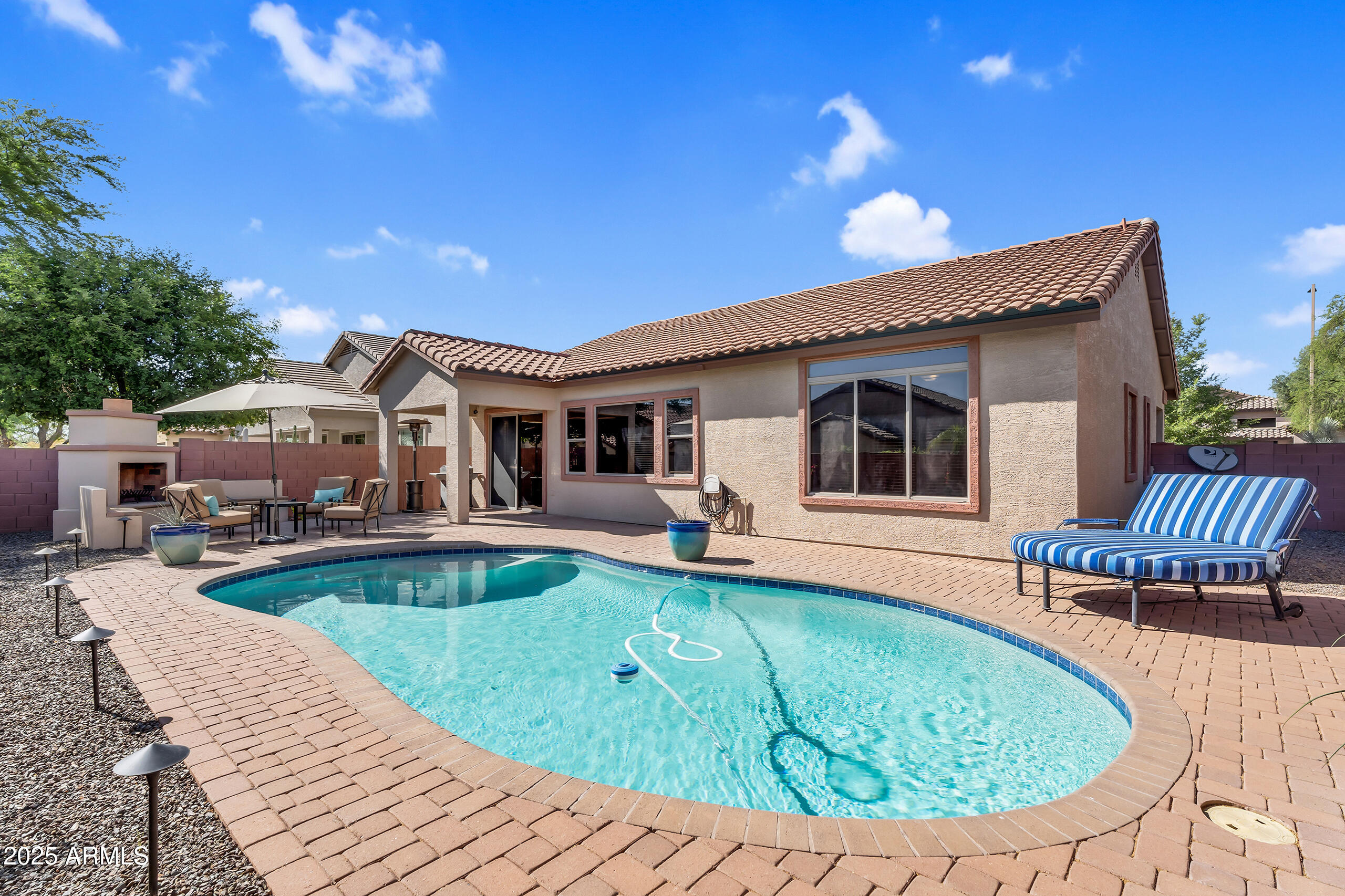 4821 East Kirkland Road Phoenix, AZ 85054 - Photo 21 of 22 a view of a house with swimming pool and sitting area