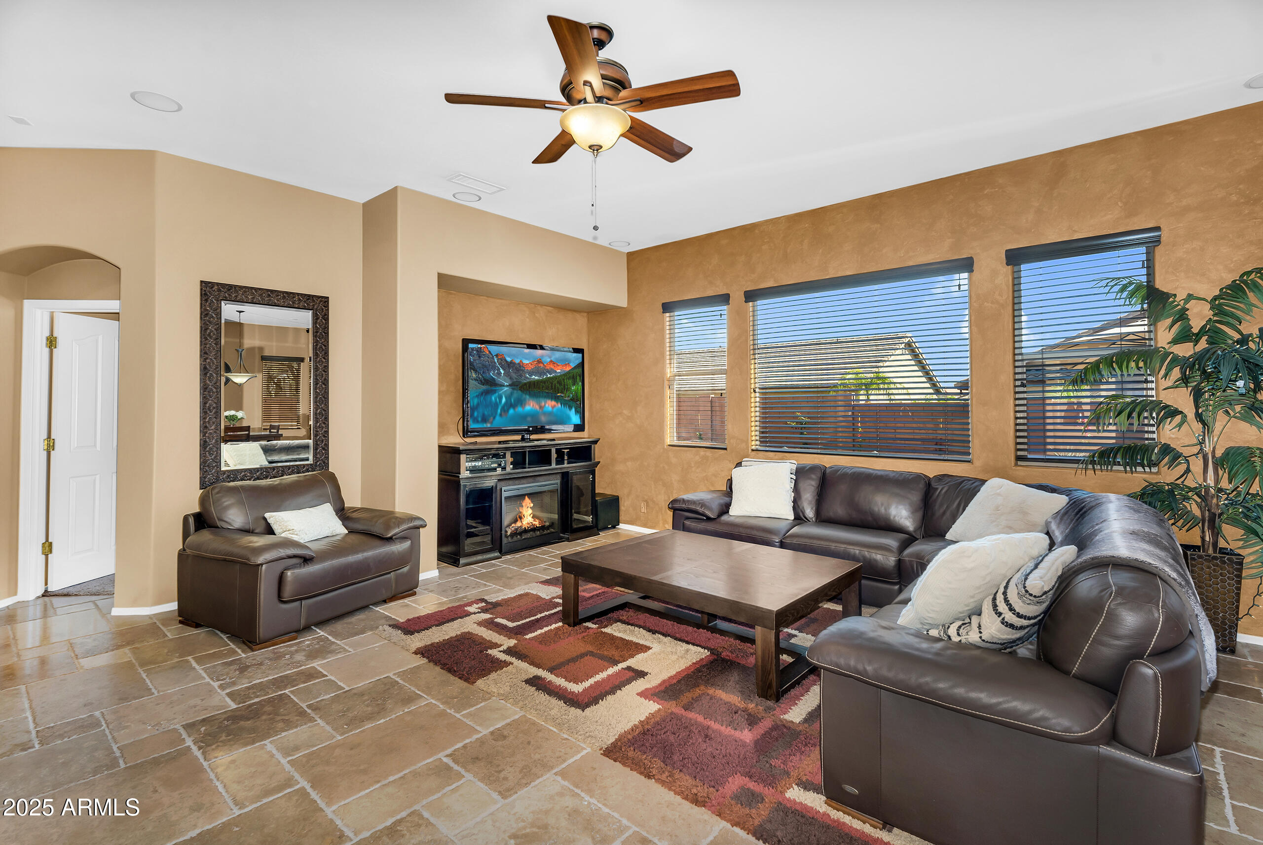 4821 East Kirkland Road Phoenix, AZ 85054 - Photo 3 of 22 a living room with furniture and a flat screen tv