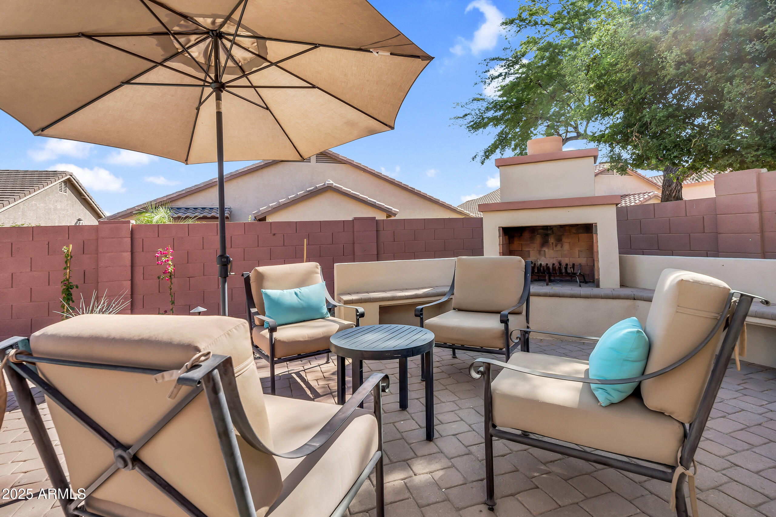 4821 East Kirkland Road Phoenix, AZ 85054 - Photo 5 of 22 a patio with a patio table and chairs