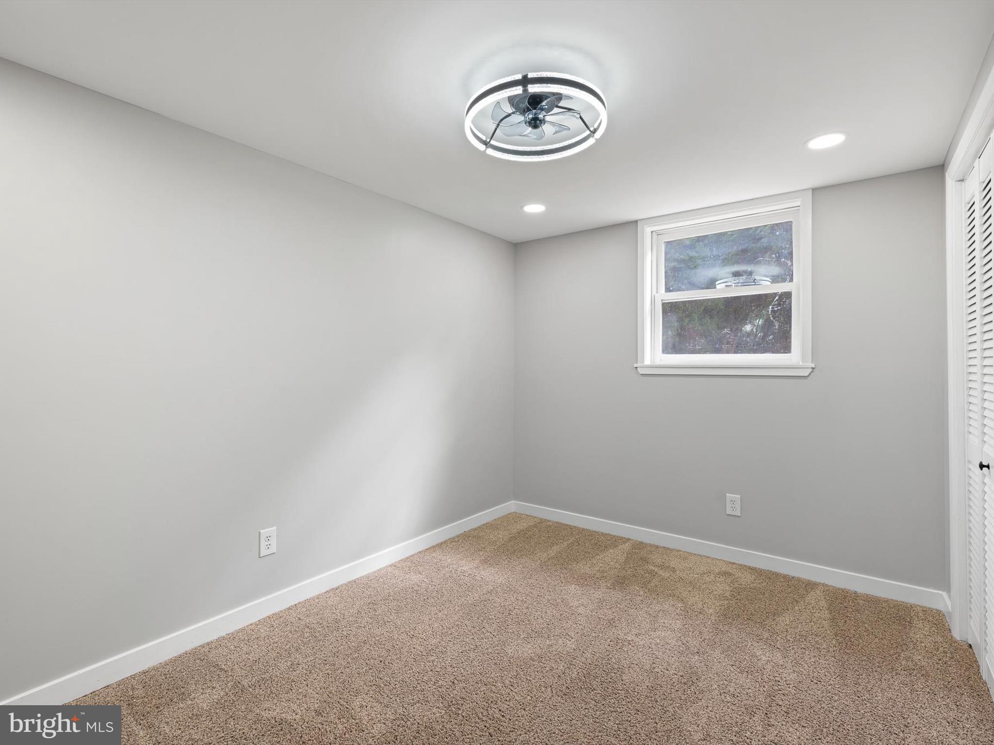 22832 Angola Road East Lewes, DE 19958 - Photo 11 of 43 an empty room with a view of a storage