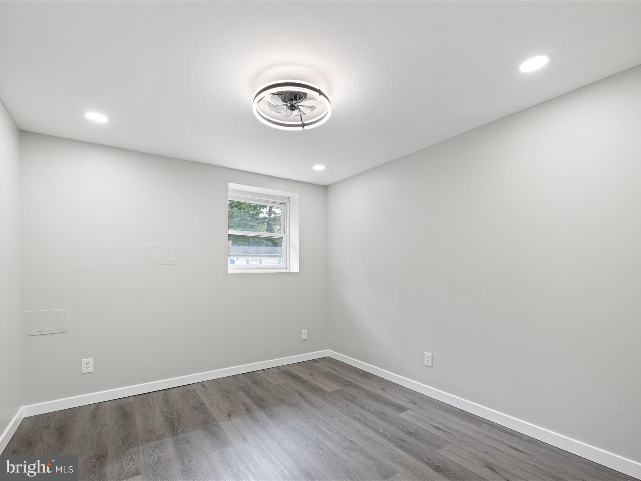 22832 Angola Road East Lewes, DE 19958 - Photo 16 of 43 an empty room with a window