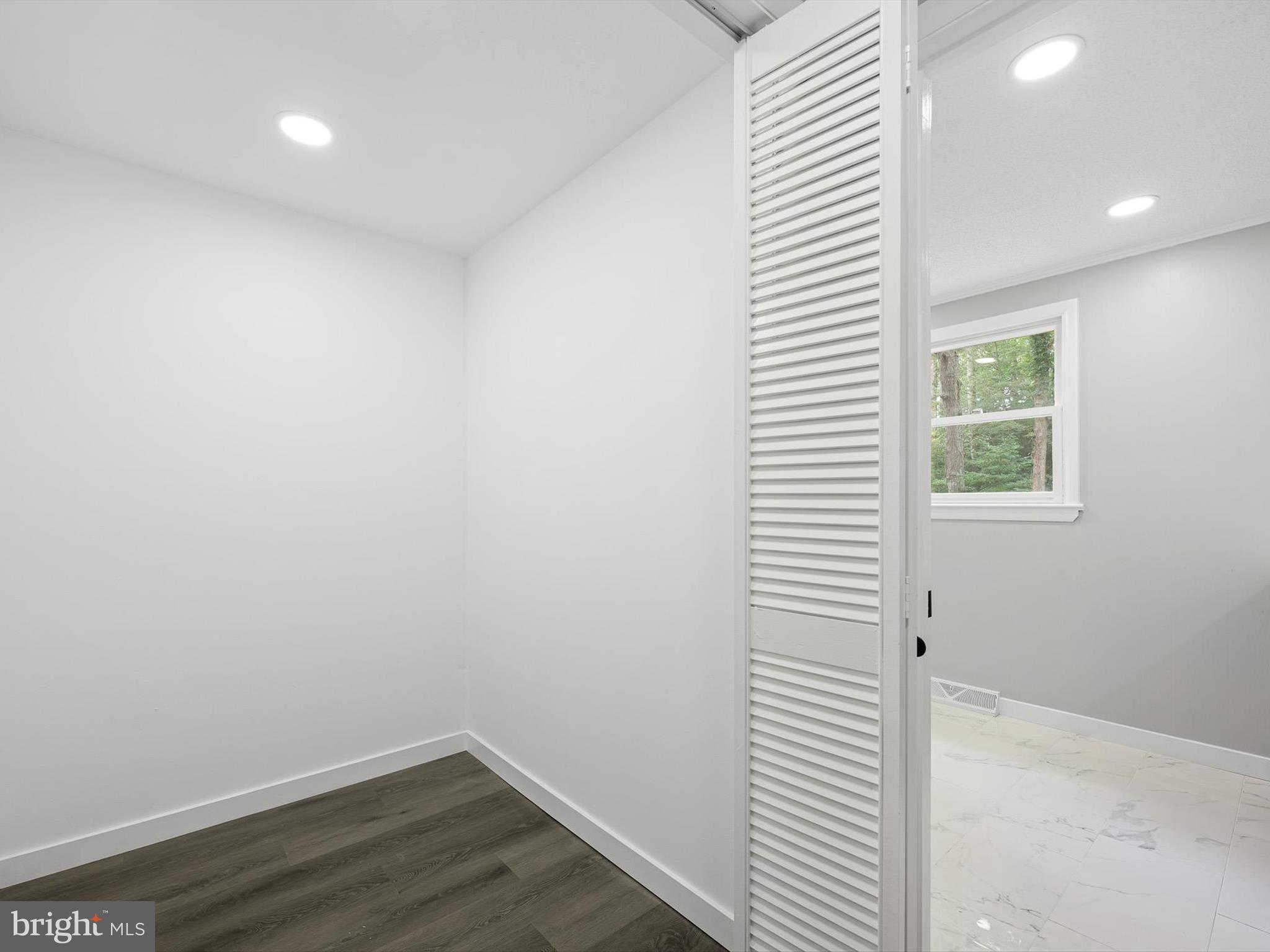 22832 Angola Road East Lewes, DE 19958 - Photo 24 of 43 a view of a room with wooden floor and a window